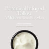 Open jar of whipped tallow cream with creamy texture, rich in botanical infusions like calendula and jojoba oil. Organic night cream and moisturizer.